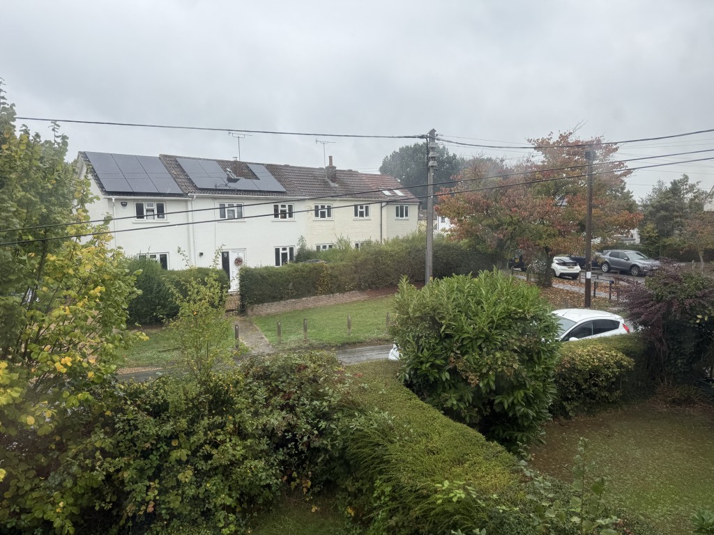Lot: 100 - FLAT IN NEED OF IMPROVEMENT IN VILLAGE LOCATION - View from Living Room in Need of Refurbishment